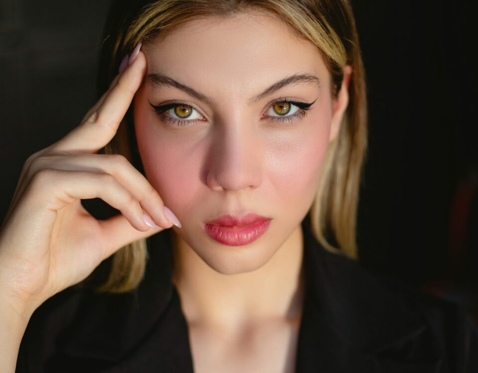 a woman in a black shirt posing for a picture