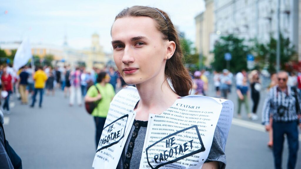 russian women's rights, woman in white and black crew neck shirt with black cardigan