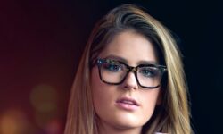 russian woman in white sweater wearing black framed eyeglasses