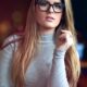 russian woman in white sweater wearing black framed eyeglasses